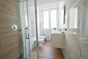 a bathroom with a toilet and a sink and a shower at [San Donato] Jewel Apartment in Florence