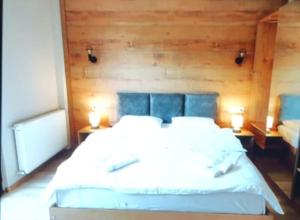Letto o letti in una camera di Mestia Roots