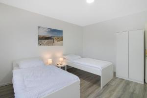 Łóżko lub łóżka w pokoju w obiekcie Comfy Apartment in Witten
