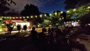 a group of people sitting in the dark at night at Caesar Residence in Budapest +255 photos