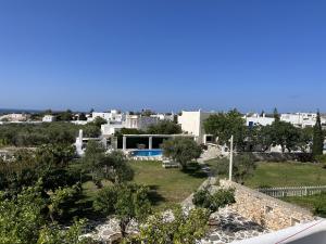 a view of a park with trees and buildings at Hotel Anezina in Drios