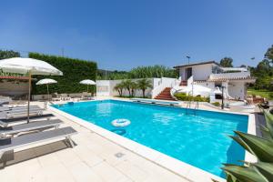 a villa with a swimming pool and a house at Villa Kore, Capo Vaticano in Capo Vaticano