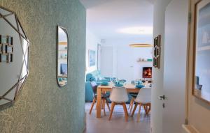 a kitchen and dining room with a table and chairs at Le Bleu Du Lac 3 étoiles - Secteur recherché, Calme & familiale, à 300m du lac & de la vieille ville, Garage privé in Annecy