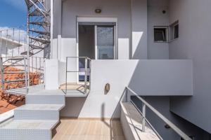 a set of stairs on a building with a stair case at Gazi Home in Athens