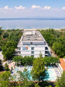 an aerial view of an office building with a pool at Sun Beach Hotel in Agia Triada