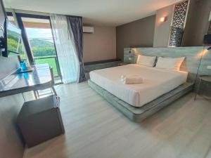 วัน บัดเจท เชียงราย เชียงแสน One Budget Hotel Chiangrai Chiangsaen客房内的一张或多张床位