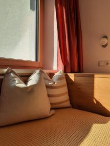 Uma cama ou camas num quarto em Valbella Appartements
