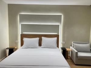 Postel nebo postele na pokoji v ubytování Elpis Guest House