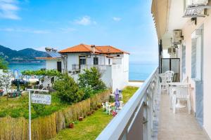 a balcony with a view of the ocean at Studios Pinelopi in Skala Potamias