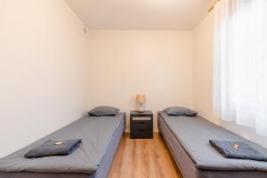 Postel nebo postele na pokoji v ubytování Posti Guesthouse
