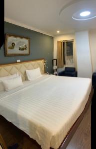 Postel nebo postele na pokoji v ubytování A25 Hotel - 61 Lương Ngọc Quyến