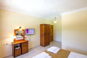 Postel nebo postele na pokoji v ubytování Yeşilkaya Hotel