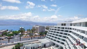 a view of a city with a large building at Amazing big studio sea view apartment - By Edom in Eilat