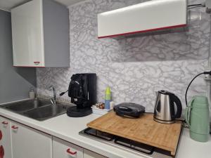 a kitchen with a sink and a counter top at B&B DOMINUS in Scafati