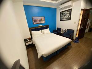 Postel nebo postele na pokoji v ubytování A25 Hotel - 61 Lương Ngọc Quyến