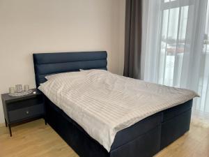 Postel nebo postele na pokoji v ubytování Lehe Premium Apartment