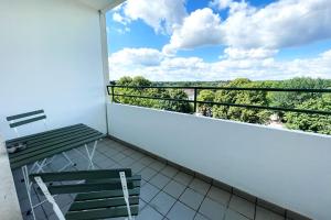 a balcony with a bench and a view at Nice Appartement in Trappenkamp in Trappenkamp