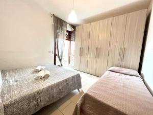 Postel nebo postele na pokoji v ubytování Vittoria Apartament