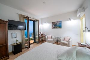 a bedroom with a bed and a view of the ocean at Solaria in Amalfi