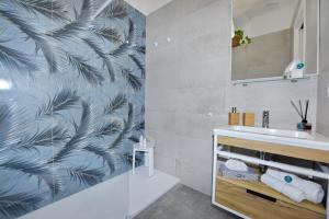 a bathroom with a sink and a shower at Luna Calante in Santa Maria di Castellabate +37 photos
