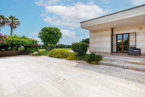 a patio in front of a building at Villa Alba fronte mare in Carovigno
