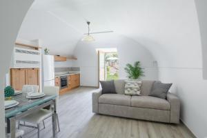 a living room with a couch and a table at Casale del Nonno in Sorrento