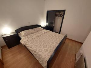 a bedroom with a bed and a large mirror at Elim in Rovinj