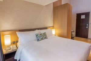 Ένα ή περισσότερα κρεβάτια σε δωμάτιο στο Kilin Hotel, JiaoXi