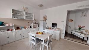 Kuchyňa alebo kuchynka v ubytovaní B&B La Perla Bianca