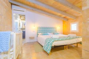 a bedroom with two beds in a room at Finca Can Setri in Sant Llorenç des Cardassar +52 photos