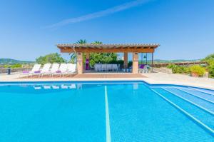 a villa with a swimming pool and a gazebo at Finca Can Setri in Sant Llorenç des Cardassar