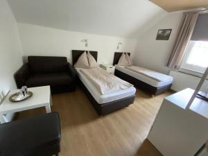 A bed or beds in a room at Pension Eder