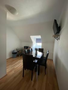 a dining room with a table and chairs at Pension Eder in Selzthal