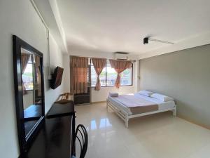 Postel nebo postele na pokoji v ubytování Citi Place Hotel ซิตี้ เพลส