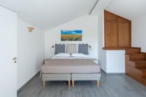 Postel nebo postele na pokoji v ubytování Casale del Nonno