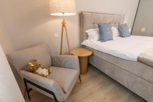 Postel nebo postele na pokoji v ubytování STORIES Design ApartHotel