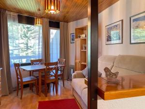 a living room with a couch and a table at Appartement Vars, 1 pièce, 4 personnes - FR-1-330B-54 in Vars