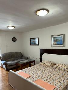 Ένα ή περισσότερα κρεβάτια σε δωμάτιο στο Apartments Jankovic