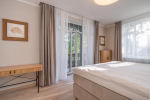 Postel nebo postele na pokoji v ubytování STORIES Design ApartHotel