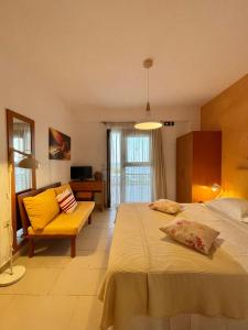A bed or beds in a room at Koumaros Aparthotel