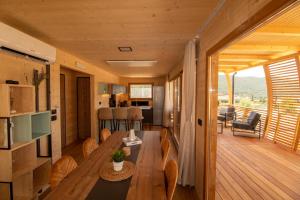 a living room with a wooden table in a tiny house at Camp Ante-Gojko in Grebaštica