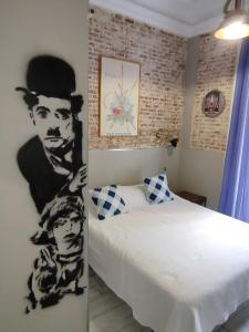 Postel nebo postele na pokoji v ubytování Hostal Hispalense + 37 fotografií