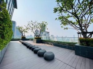 a row of tires sitting on the floor of a building at Luxury 1Bed 1Bath 300m BTS Phrom Phong, Emporium EmSphere EmQuartier in Bangkok