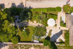 an aerial view of a garden with a bridge at La Casita Holiday Home in Petrcane