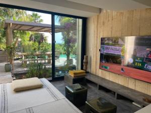 a bedroom with a video game on the wall at Villa Bali in Cassis