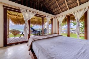 Postel nebo postele na pokoji v ubytování Hotel CasaBakal - A pie de Laguna - Bacalar