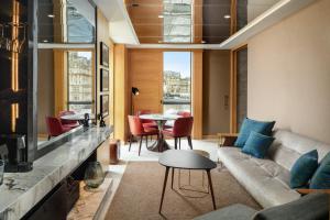 a living room with a couch and a table at Market Street hotel in Edinburgh