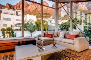 a living room with a view of the mountains at Lobster Villa in Cape Town
