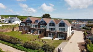 an aerial view of a large house at Apartment 9, Searush Cove in Hope Cove