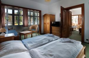 Łóżko lub łóżka w pokoju w obiekcie Depandance Villa Hubertus